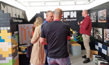 Visitors at Morph stand at #CDW2023 discuss the sustainable qualities of Morph and Morph Bio